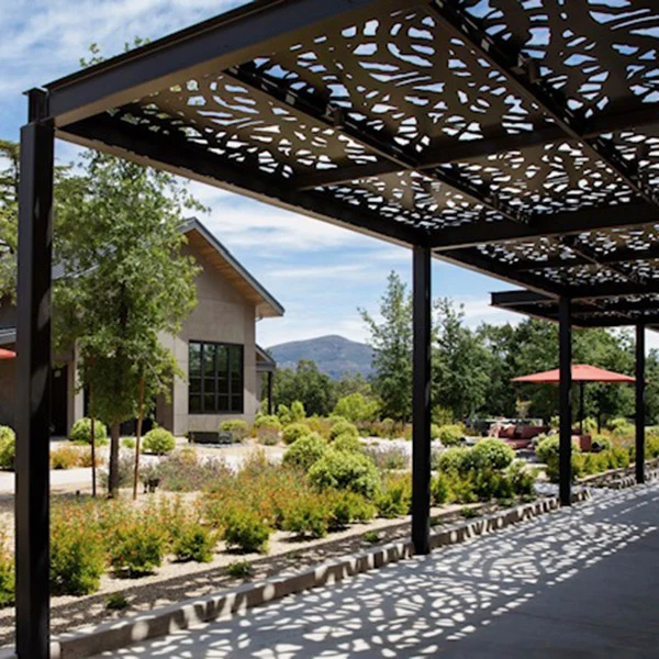 Finished decorative shade panels over a landscaped patio