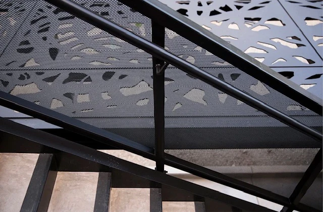 Bello Aluminum patterned panels along a stairway