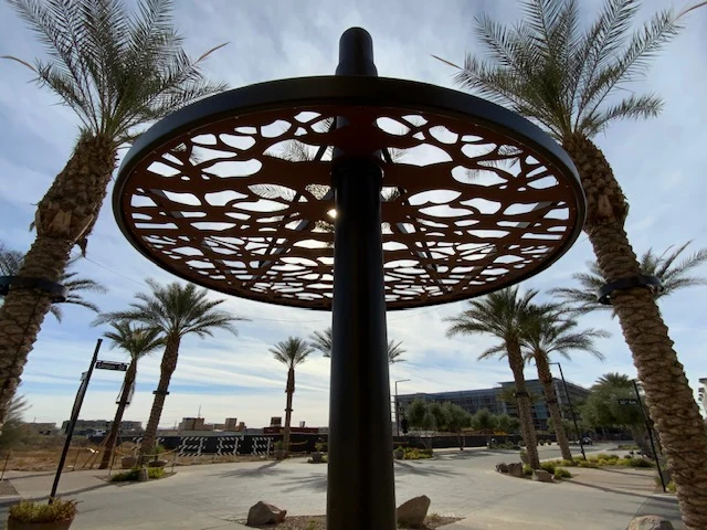 Circular decorative shade panel installed outdoors