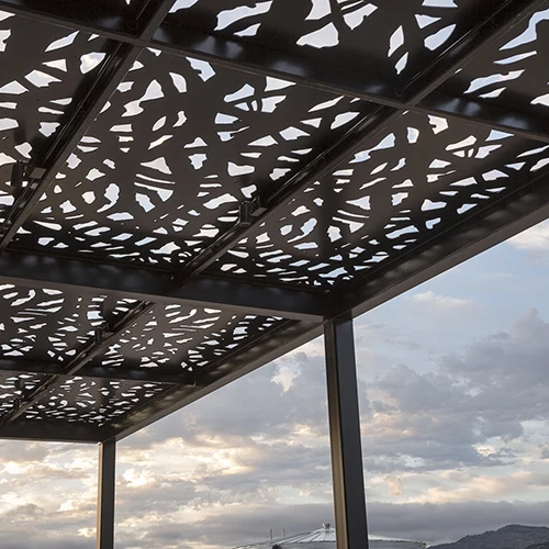 Decorative architectural panels shading a completed outdoor project